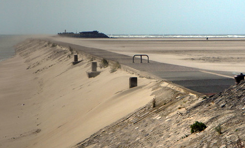 Wind blowing sand across the walkway at Petit Fort Philippe on the north coast of France