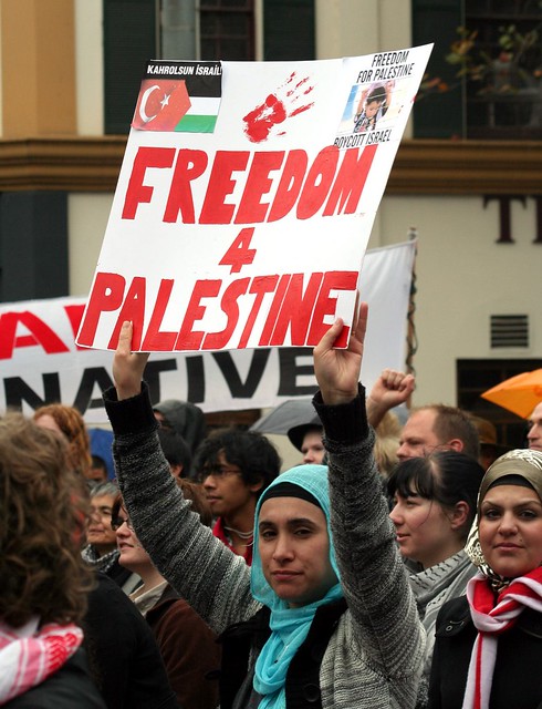 Woman holding placard - Freedom for Palestine