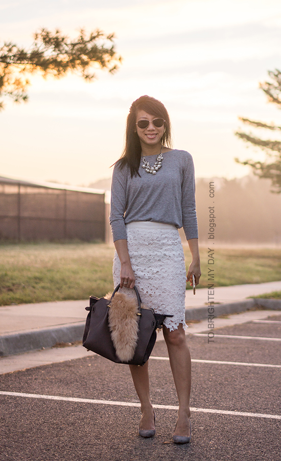 mixed pearl necklace, gray button back sweater, white floral lace pencil skirt, gray tote bag accessorized with faux fur scarf, gray suede pumps