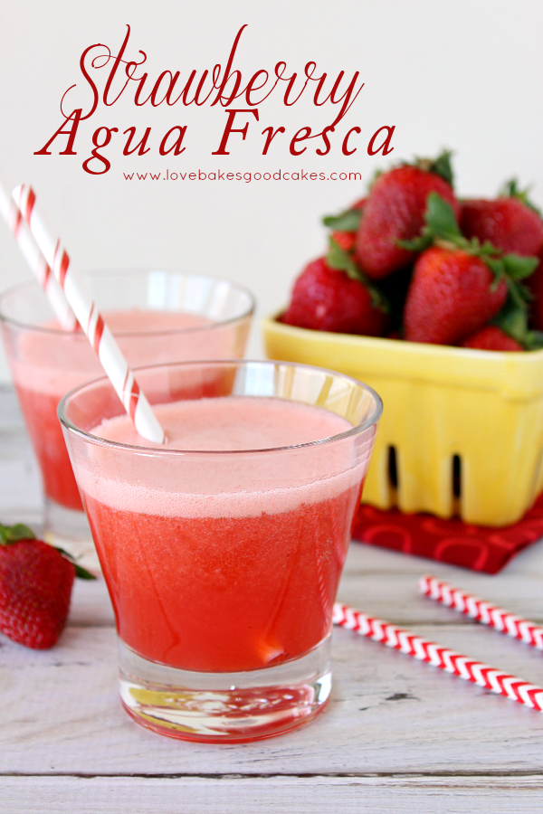 Strawberry Agua Fresca in two glasses with fresh strawberries. 