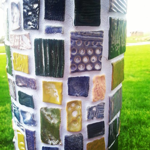 Ceramic pole tiles. Part of the summer arts program izzy worked on two years ago.