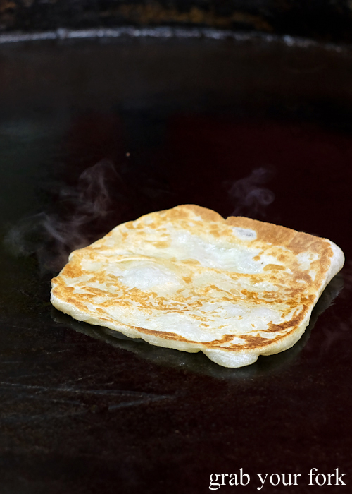 Cooking parata on the grill at the Ramadan food festival in Lakemba Sydney