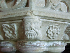 bewhiskered man on the font