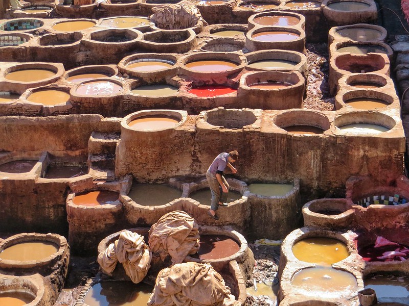 Stepping amongst the leather tannery pits in Fez, Morocco
