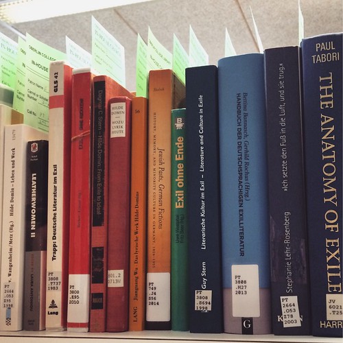 A row of library books on a shelf