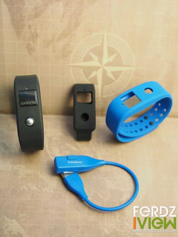 Two wristbands, a clip and USB charger