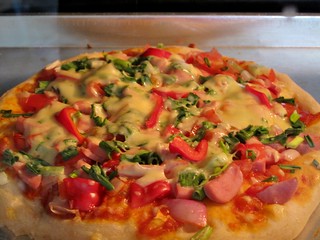 010 Baking of a spring onion and sausage pizza