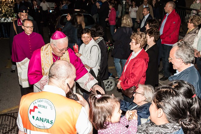 Archbishop Nosiglia shaking hands with senior citizens.