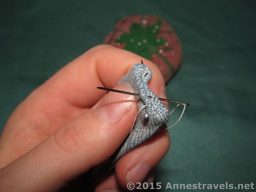Hand sewing the end of the hand sanitizer bottle holder