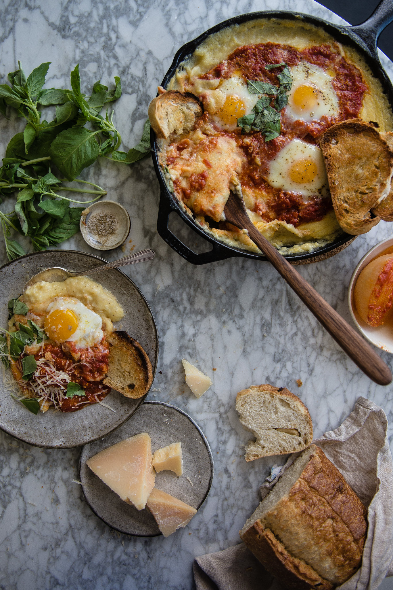creamy baked polenta with eggs and tomato sauce | two red bowls