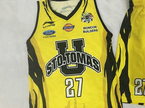 UST yellow basketball uniform