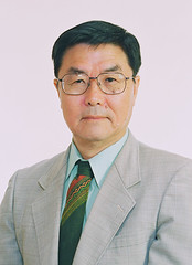 professional photo of Keijiro Otsuka wearing a gray suit