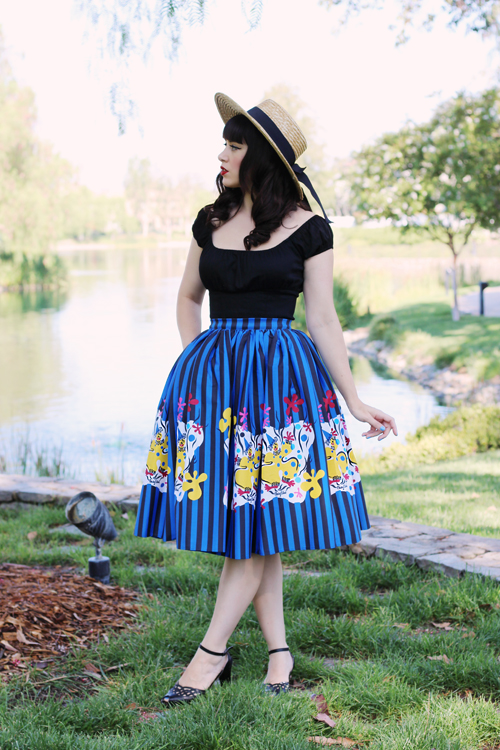 Pinup Girl Clothing Pinup Couture Jenny Skirt in Mary Blair Clown Border Print Peasant Top in Black Sateen